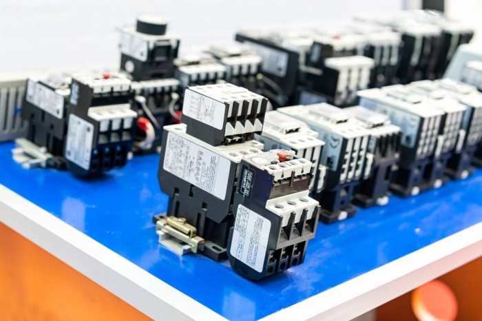 Mechanically held relays and contactors are often used because